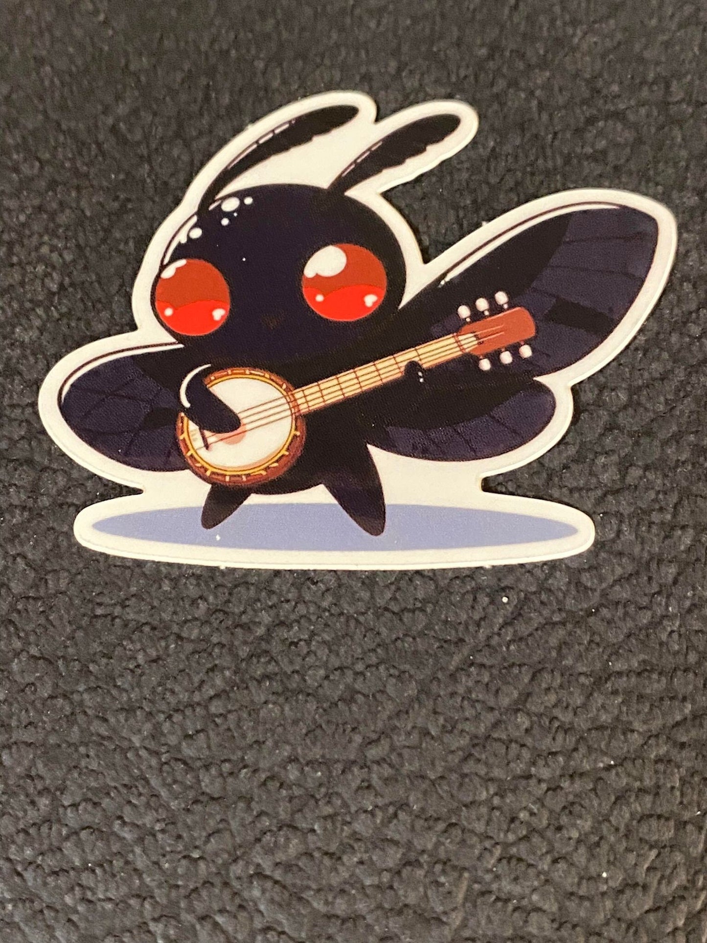 Banjo Playing Mothman Sticker