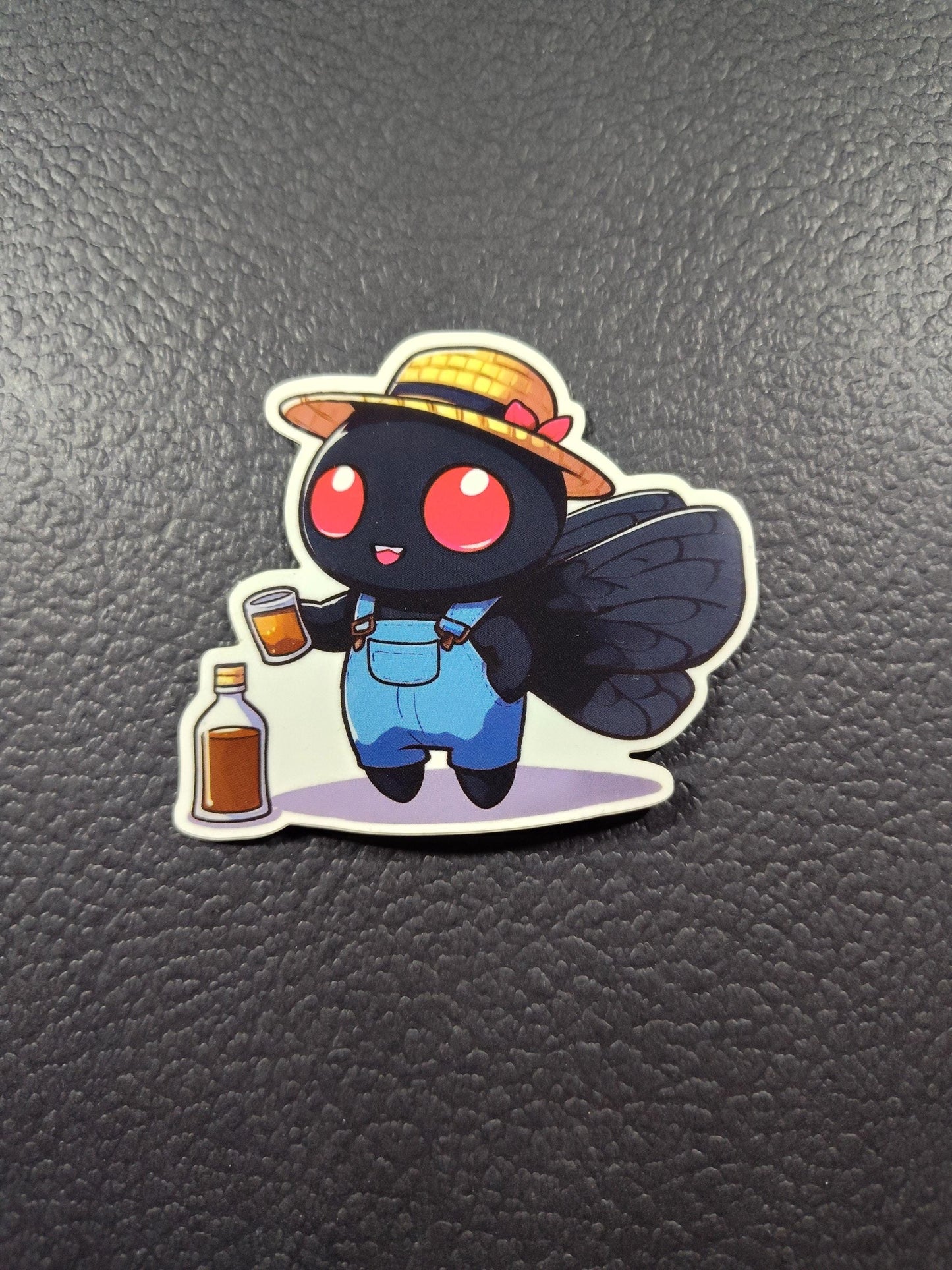 Mothman sipping: Mothman whiskey Sticker