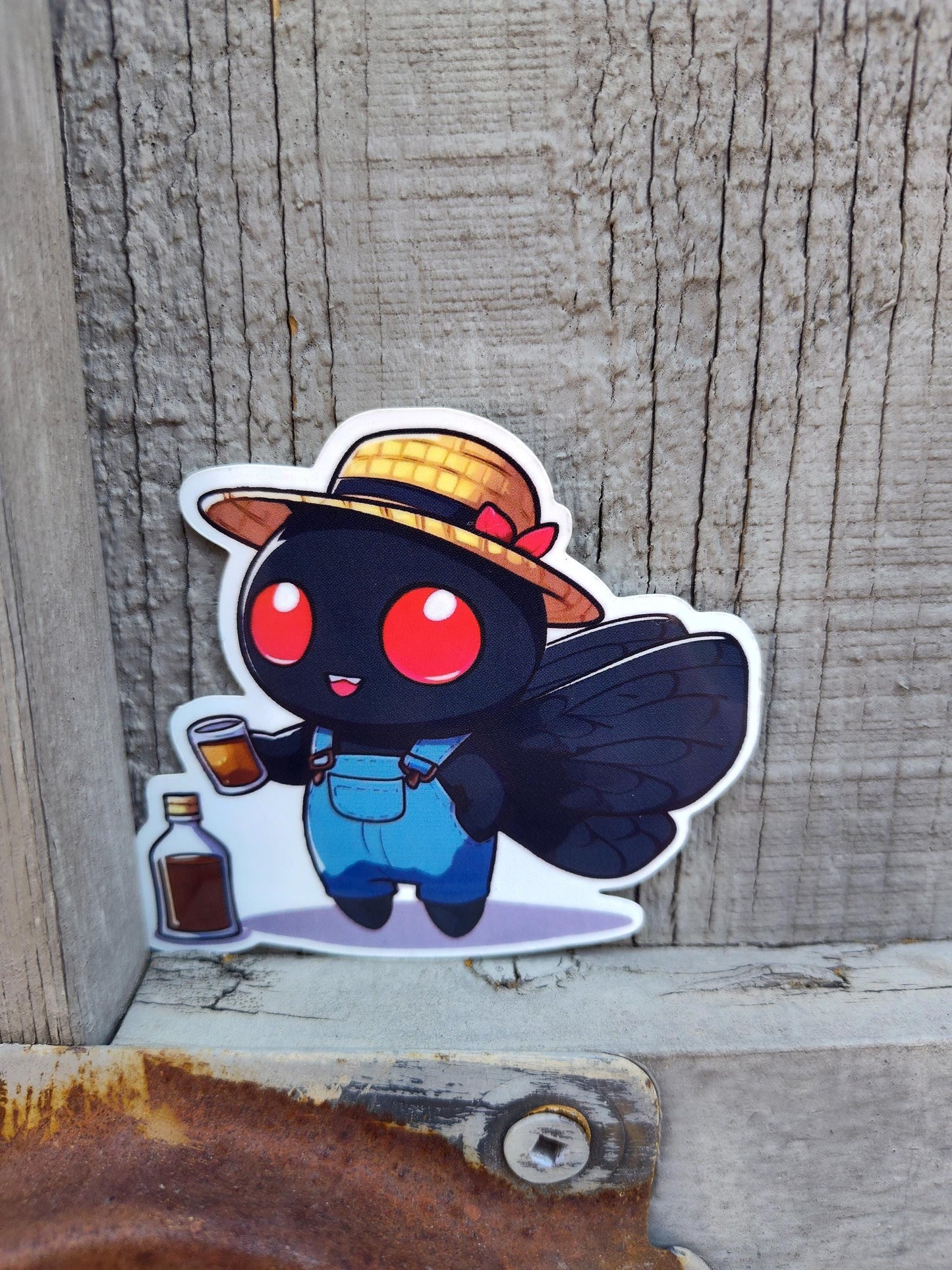 Mothman sipping: Mothman whiskey Sticker
