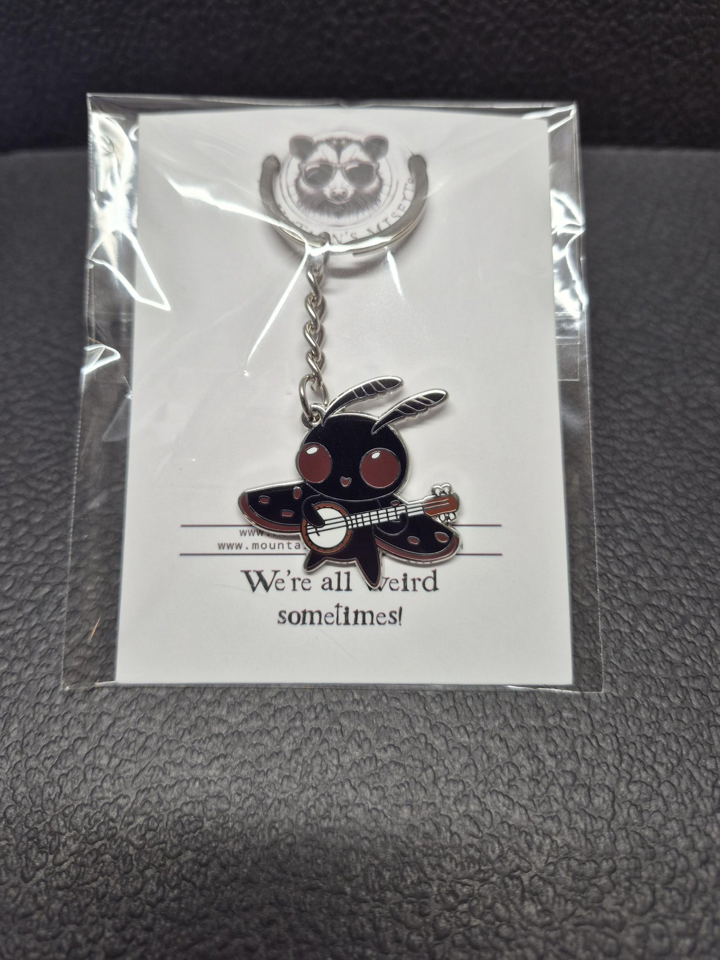 Mothman w/ Banjo Enamel Keychain - Cryptid Keychain